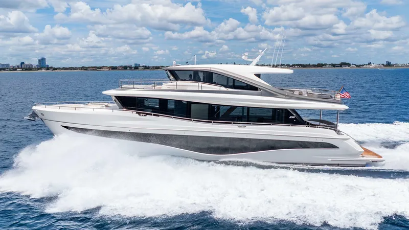 The Image of 2024 Princess X80 yacht cruising on open water under a partly cloudy sky. - 0