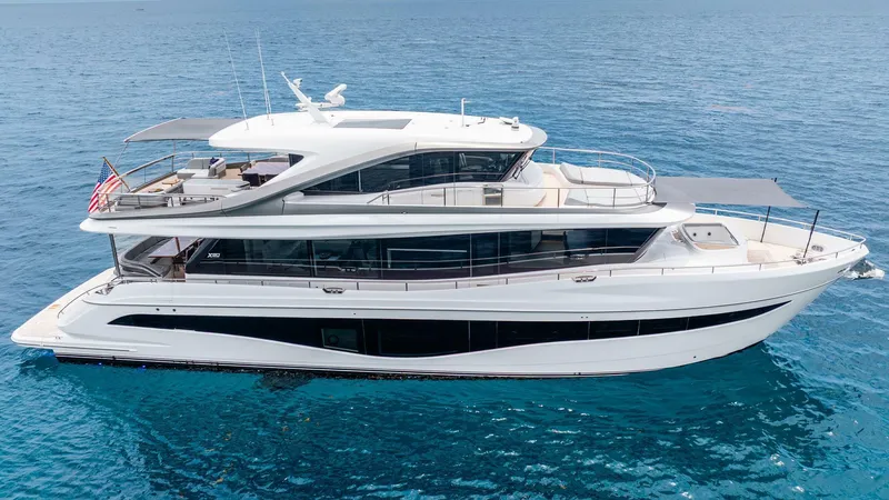 Slide: The Image of Luxurious 2024 Princess X80 yacht cruising on clear blue ocean waters. - 1