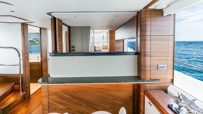 Slide: The Image of Luxurious interior of 2024 Princess X80 yacht with wood finishes and ocean view. - 18