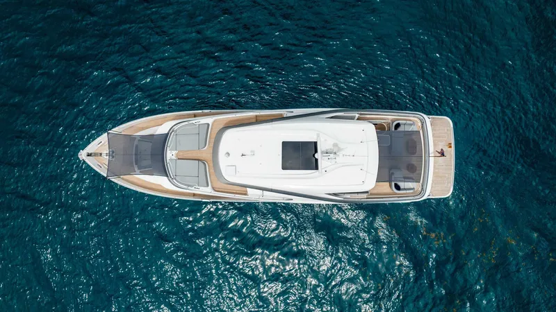 Slide: The Image of Aerial view of 2024 Princess X80 yacht on clear blue water. - 2