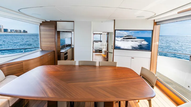 Slide: The Image of Luxurious interior of 2024 Princess X80 yacht with ocean view and elegant wooden dining table. - 29