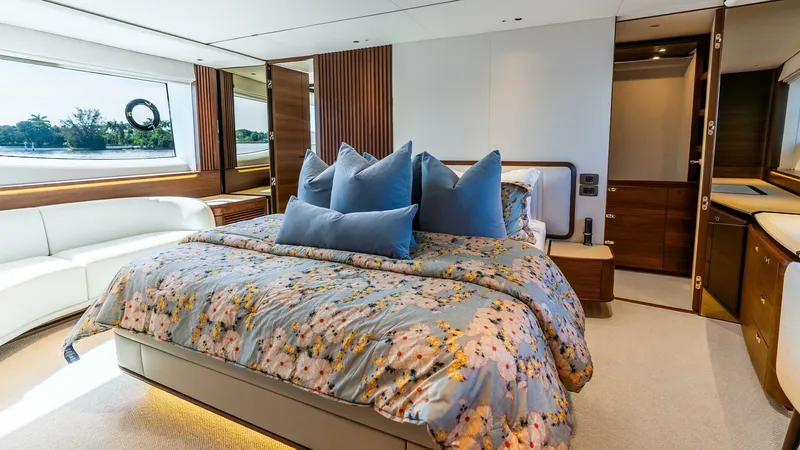 Slide: The Image of Luxurious 2024 Princess X80 yacht bedroom with elegant decor and large windows. - 32