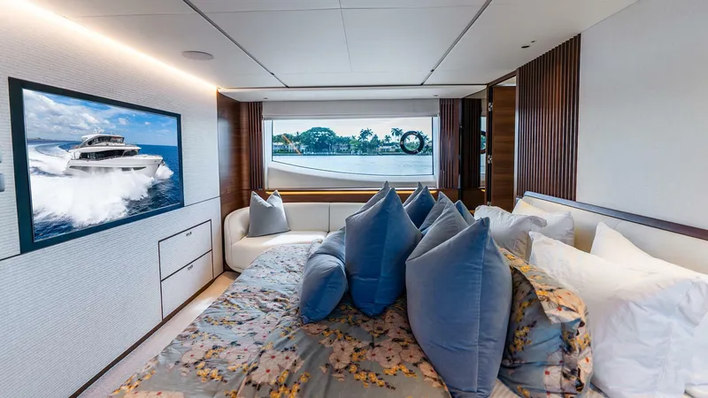 Slide: The Image of Luxurious bedroom interior of 2024 Princess X80 yacht with elegant decor and scenic window view. - 33