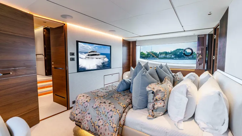 Slide: The Image of Luxurious 2024 Princess X80 yacht bedroom with elegant decor and scenic window view. - 34