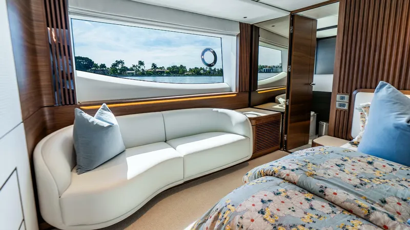 Slide: The Image of Luxurious interior of 2024 Princess X80 yacht with elegant seating and scenic window view. - 36