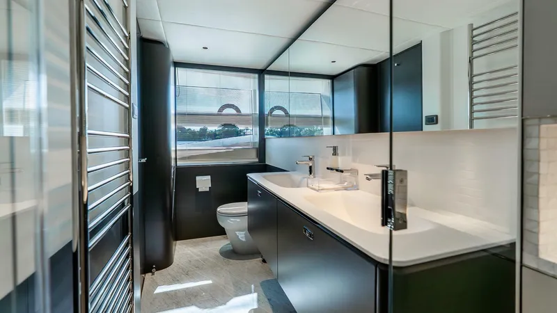 Slide: The Image of Luxurious bathroom interior of 2024 Princess X80 yacht, featuring modern fixtures and sleek design. - 37
