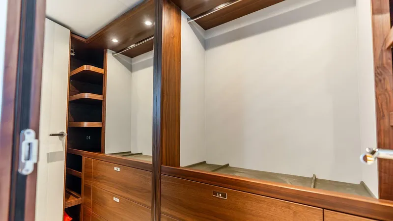 Slide: The Image of Luxurious wooden wardrobe interior on 2024 Princess X80 yacht. - 38