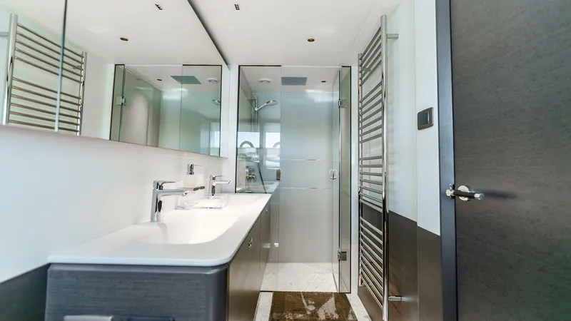 Slide: The Image of Luxurious bathroom in 2024 Princess X80 yacht with modern fixtures and glass shower. - 39
