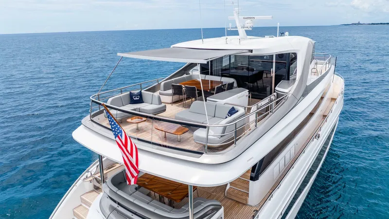Slide: The Image of Luxurious 2024 Princess X80 yacht on open sea, featuring spacious deck and elegant design. - 4
