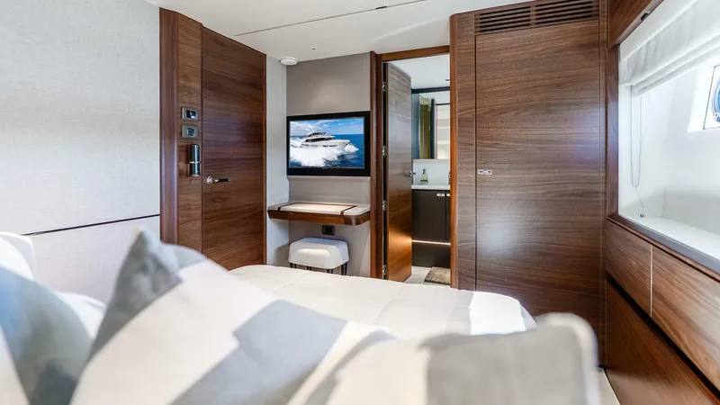 Slide: The Image of Luxurious interior of 2024 Princess X80 yacht cabin with modern wood finishes. - 42