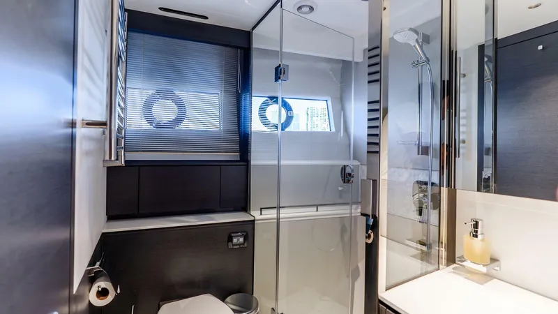 Slide: The Image of Luxurious bathroom in 2024 Princess X80 yacht with modern fixtures and glass shower. - 47