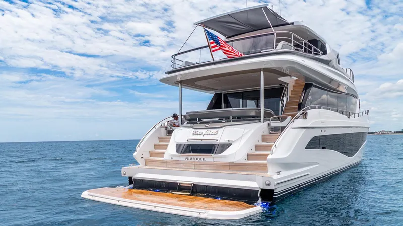 Slide: The Image of Luxurious 2024 Princess X80 yacht on open sea with American flag. - 9