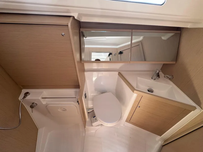 Slide: The Image of Modern bathroom interior of 2025 Beneteau Oceanis 40.1 yacht, featuring sleek design and fixtures. - 13