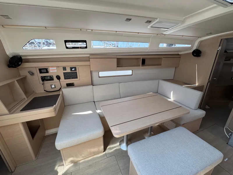 Slide: The Image of 2025 Beneteau Oceanis 40.1 interior with modern seating and navigation station. - 16