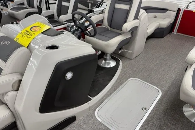 Slide: The Image of 2025 Barletta Cabrio 22QC boat interior with modern seating and steering console. - 5