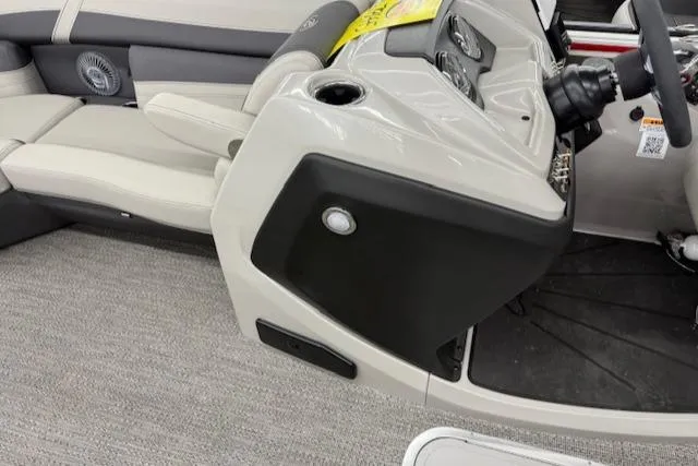 Slide: The Image of 2025 Barletta Cabrio 22QC boat interior with modern dashboard and seating. - 9