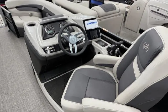 Slide: The Image of 2025 Barletta Cabrio 22QC boat interior with modern steering and seating. - 7