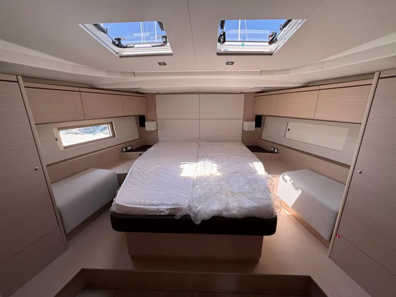 Slide: The Image of Luxurious cabin interior of 2024 Beneteau Oceanis 51.1 yacht with skylights and modern design. - 11