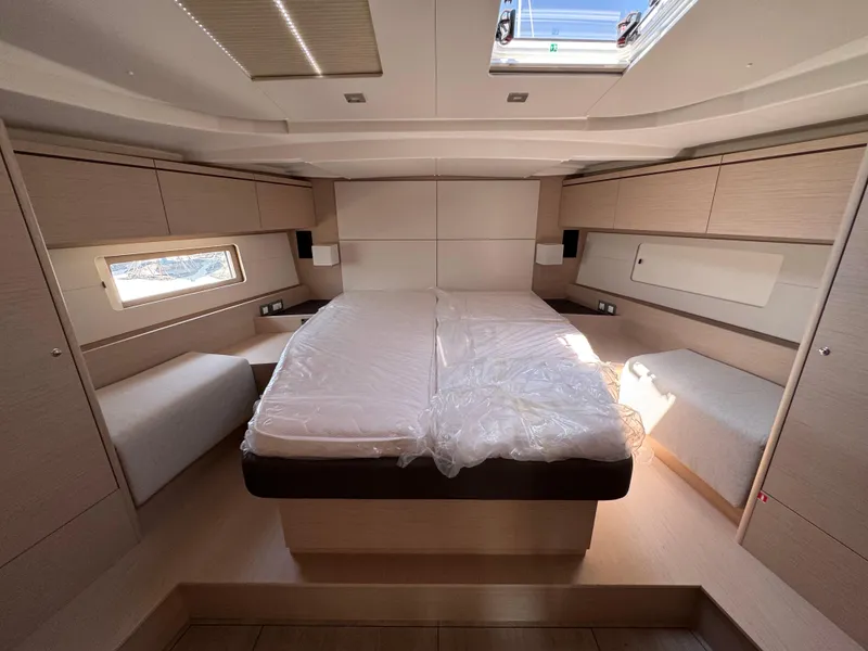 Slide: The Image of Luxurious interior of 2024 Beneteau Oceanis 51.1 yacht cabin with modern design. - 14
