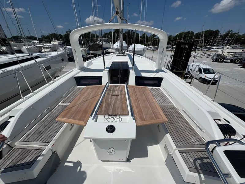 Slide: The Image of 2024 Beneteau Oceanis 51.1 yacht deck with wooden seating and modern design. - 5