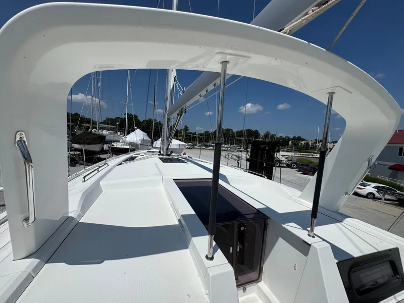 Slide: The Image of 2024 Beneteau Oceanis 51.1 yacht deck view, showcasing sleek design and marina background. - 6