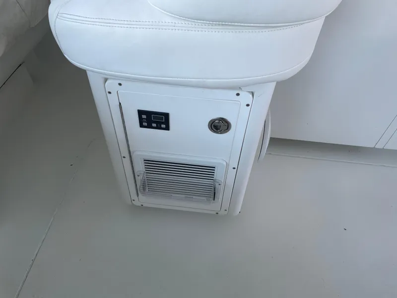 Slide: The Image of White seat with integrated control panel on 1998 Hatteras 39 Sport Express boat. - 20