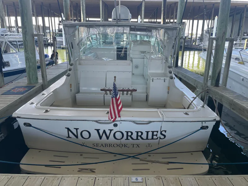 Slide: The Image of 1998 Hatteras 39 Sport Express boat docked, named "No Worries," in Seabrook, Texas. - 8