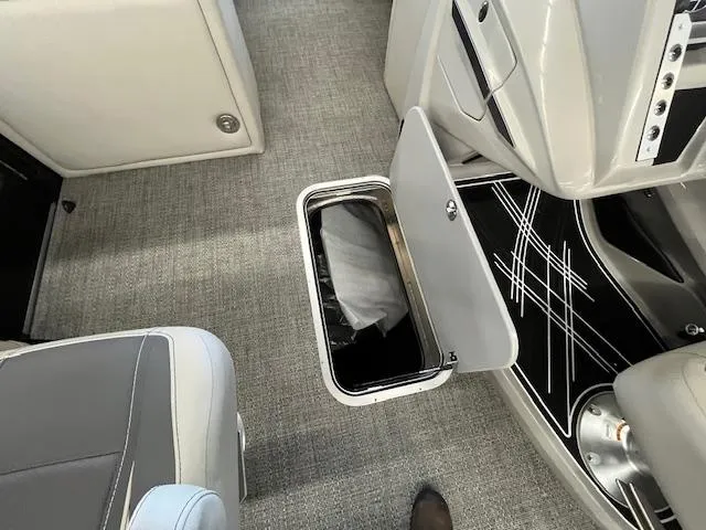 Slide: The Image of 2025 Barletta CORSA 23QC boat interior with open storage compartment and modern design. - 12