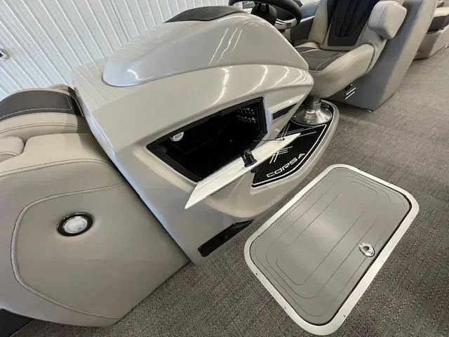 Slide: The Image of 2025 Barletta CORSA 23QC boat interior with storage compartment and sleek design. - 19