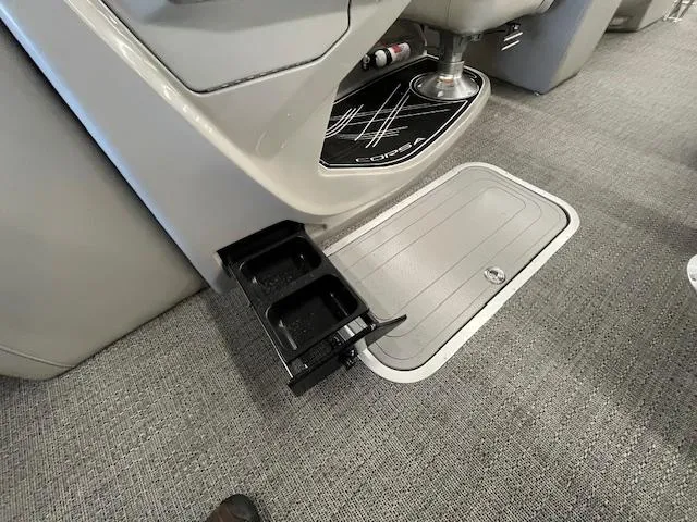 Slide: The Image of 2025 Barletta CORSA 23QC interior with cup holder and storage compartment. - 20