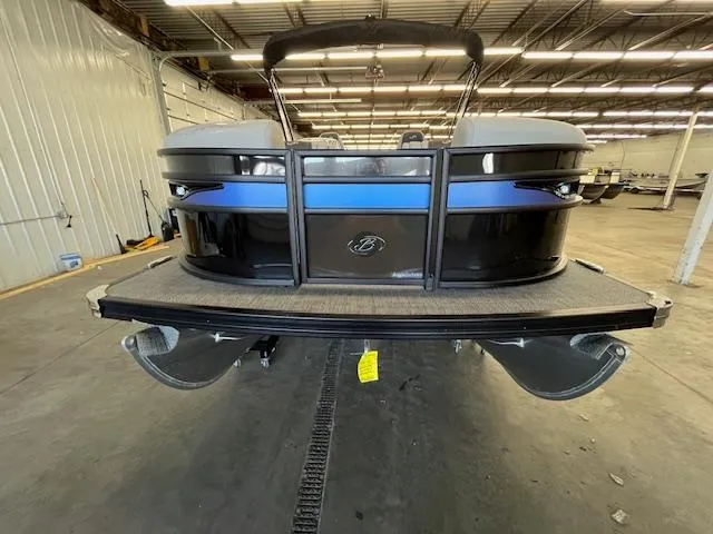 Slide: The Image of 2025 Barletta CORSA 23QC pontoon boat in a warehouse setting, rear view. - 5