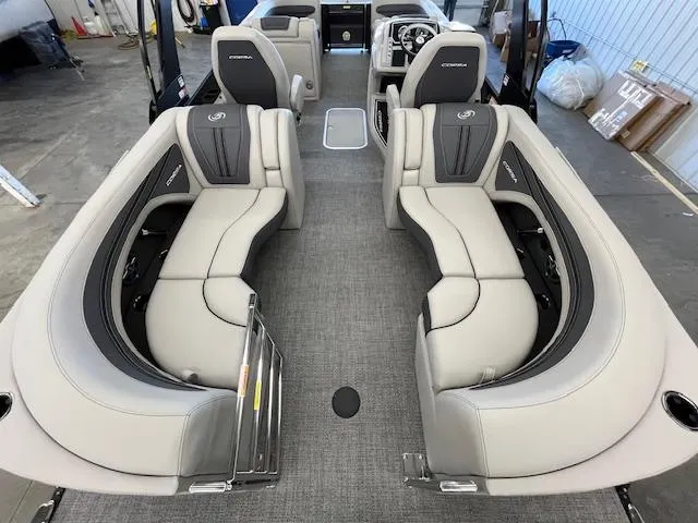 Slide: The Image of 2025 Barletta CORSA 23QC pontoon boat interior with luxurious seating and modern design. - 6