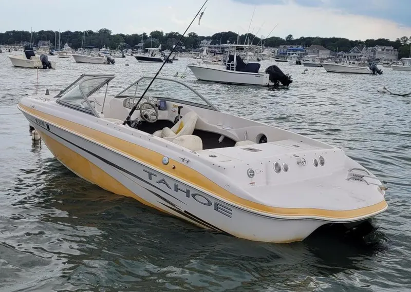 Slide: The Image of 2007 Tahoe Q6 Tracker boat docked in a busy marina. - 3