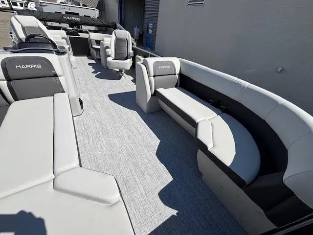 Slide: The Image of 2025 Harris Cruiser 230 boat interior with gray seating and modern design. - 10