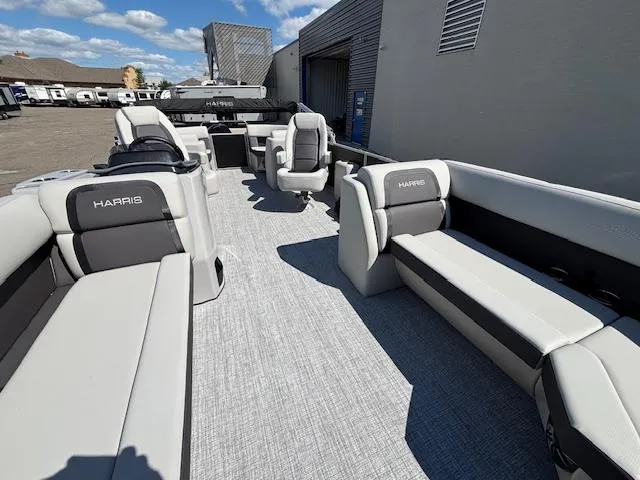 Slide: The Image of 2025 Harris Cruiser 230 pontoon boat with spacious seating and modern design. - 11