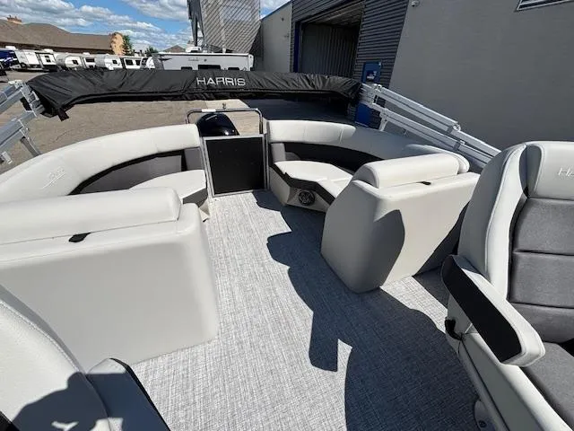 Slide: The Image of 2025 Harris Cruiser 230 pontoon boat interior with plush seating and modern design. - 14