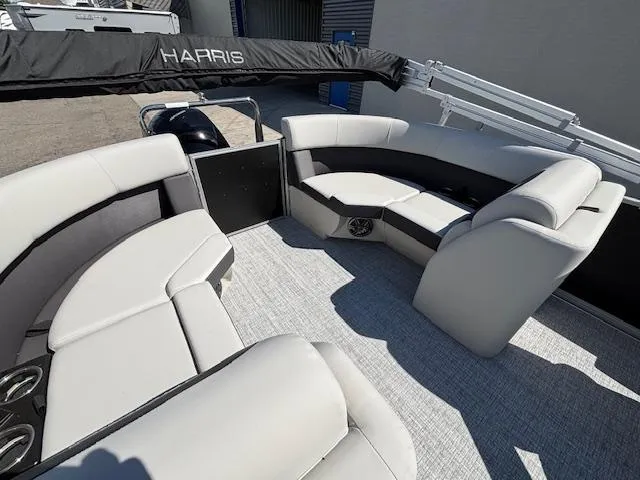 Slide: The Image of 2025 Harris Cruiser 230 pontoon boat with spacious seating and modern design. - 15