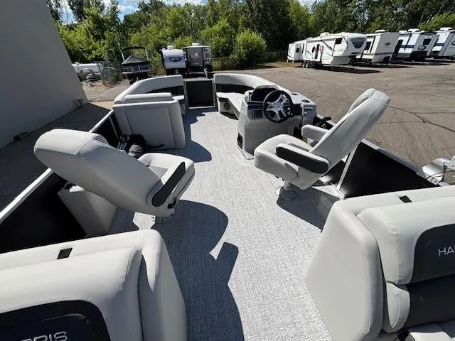Slide: The Image of 2025 Harris Cruiser 230 pontoon boat interior with plush seating and modern helm. - 16
