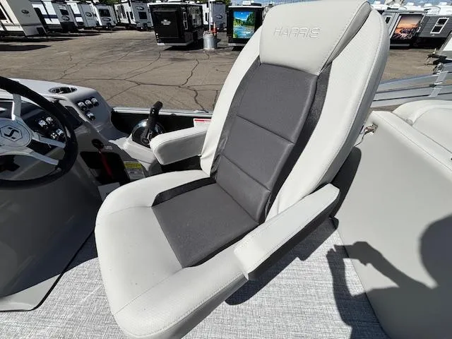 Slide: The Image of Captain's chair on 2025 Harris Cruiser 230 boat, featuring sleek design and comfortable seating. - 19