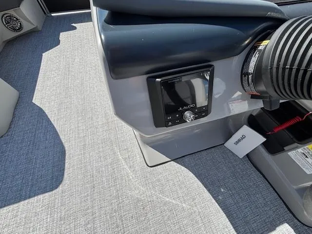 Slide: The Image of 2025 Harris Cruiser 230 boat interior with JL Audio system and Simrad equipment. - 22