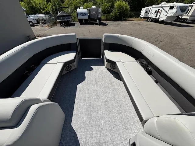 Slide: The Image of 2025 Harris Cruiser 230 pontoon boat interior with spacious seating and modern design. - 24