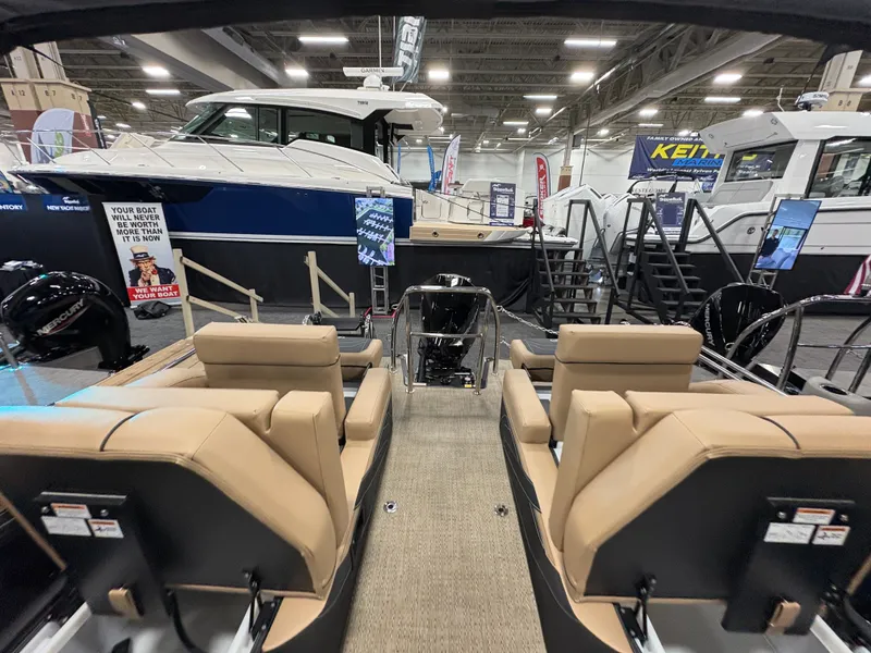 Slide: The Image of Interior view of Barletta Cabrio 22 M, 2026 model, at a boat show. - 8