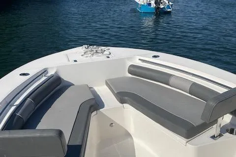 Slide: The Image of 2022 Sea Born LX24 Center Console boat with spacious seating on calm water. - 4