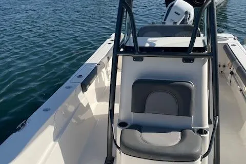 Slide: The Image of 2022 Sea Born LX24 Center Console boat on water, showcasing seating and console. - 5