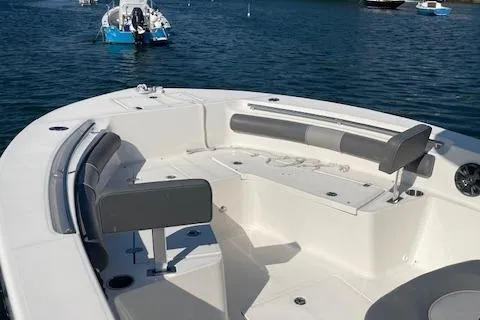 Slide: The Image of 2022 Sea Born LX24 Center Console boat with spacious seating on calm water. - 9