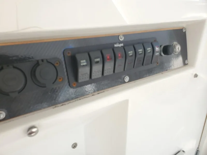 Slide: The Image of Control panel on 1988 Post 46 Sportfish boat with labeled switches. - 25