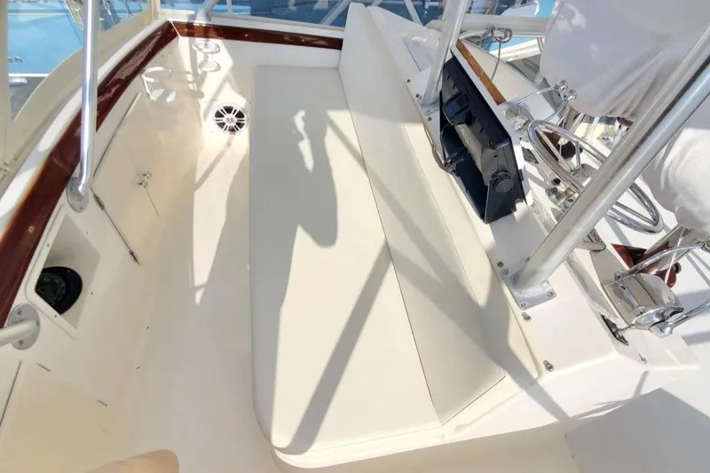 Slide: The Image of 1988 Post 46 Sportfish boat interior with white seating and wood trim. - 27