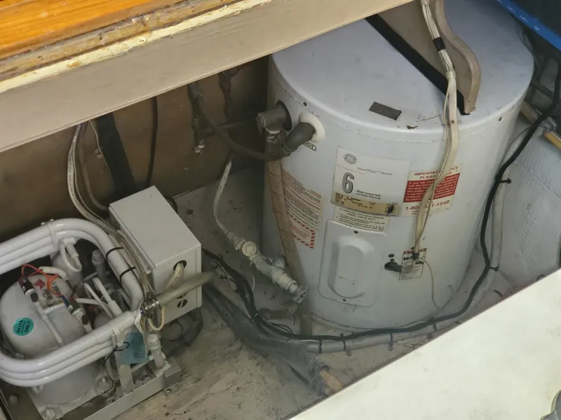 Slide: The Image of Engine room of 1988 Post 46 Sportfish boat, showing mechanical components. - 31