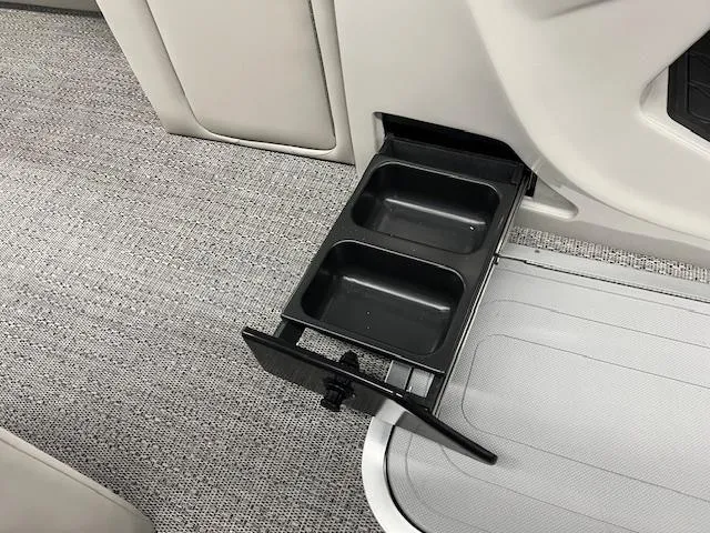Slide: The Image of 2025 Barletta Lusso 25UC boat interior with retractable dual cup holder. - 12