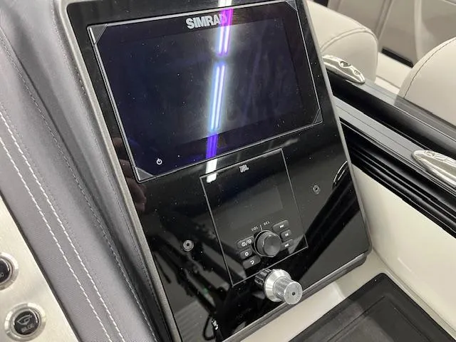 Slide: The Image of Control panel of 2025 Barletta Lusso 25UC boat with Simrad display. - 18